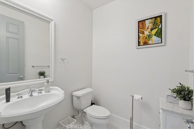 bathroom featuring sink and toilet