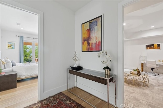 corridor featuring hardwood / wood-style flooring