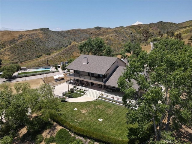 birds eye view of property featuring a mountain view