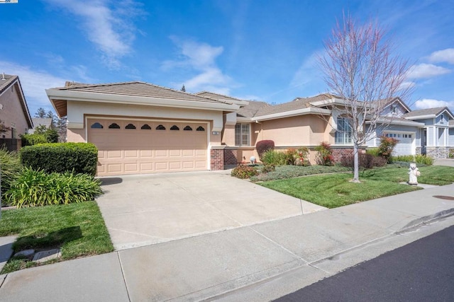 ranch-style home featuring a front lawn and a garage