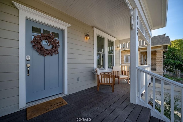 wooden terrace featuring a porch