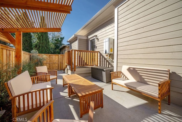 view of patio / terrace with an outdoor living space and a pergola