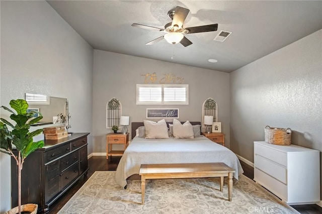 bedroom featuring ceiling fan, vaulted ceiling, and hardwood / wood-style flooring