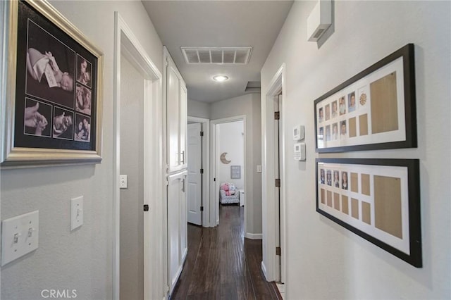 corridor with dark hardwood / wood-style floors