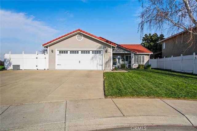 ranch-style house featuring a front lawn and a garage