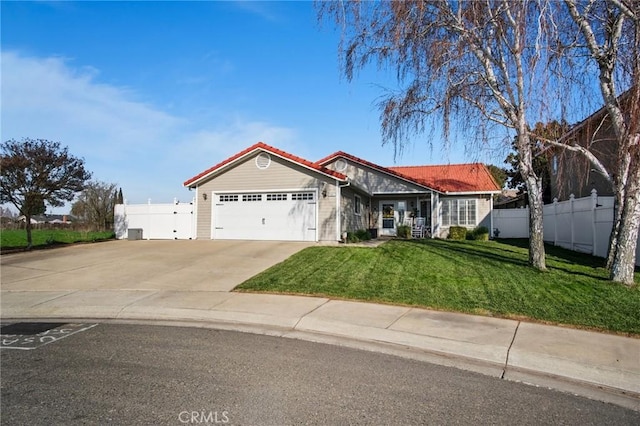 ranch-style house with a front yard and a garage