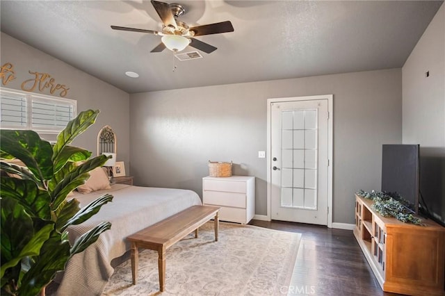 bedroom featuring ceiling fan and dark hardwood / wood-style flooring