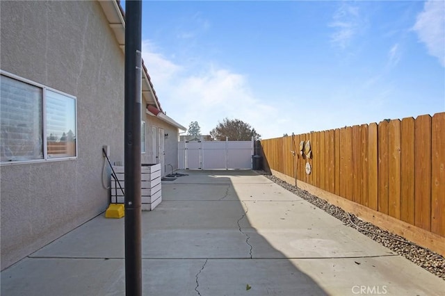 view of side of property with a patio area