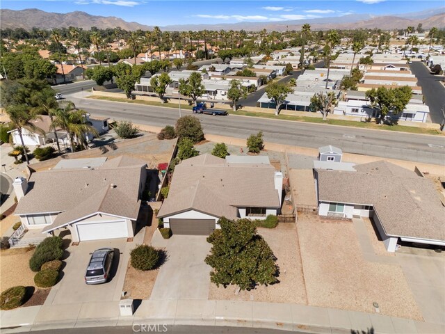 birds eye view of property with a mountain view