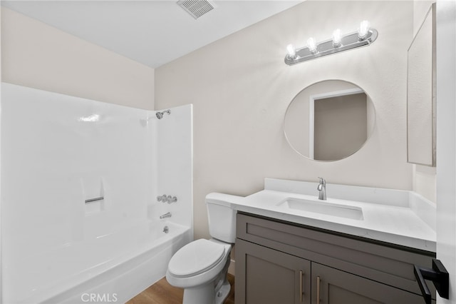 full bathroom with shower / bathtub combination, hardwood / wood-style floors, toilet, and vanity