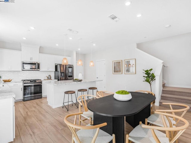 dining room featuring light hardwood / wood-style flooring