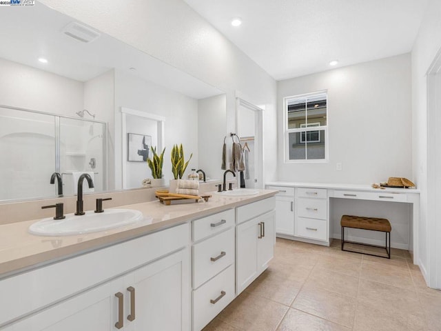 bathroom featuring an enclosed shower, vanity, and tile patterned flooring