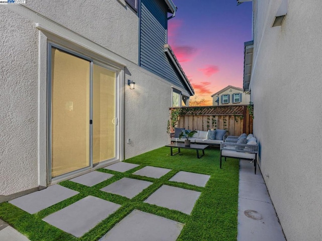 patio terrace at dusk with outdoor lounge area