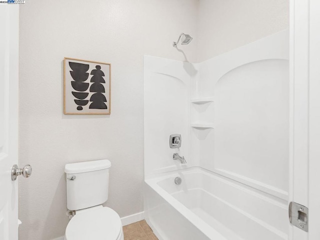 bathroom featuring toilet, tile patterned floors, and tub / shower combination