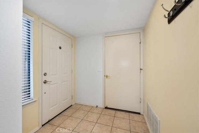 entryway featuring light tile patterned floors