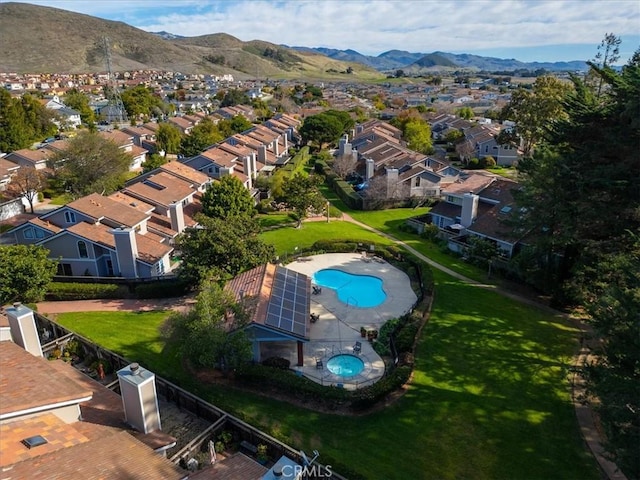 birds eye view of property featuring a mountain view