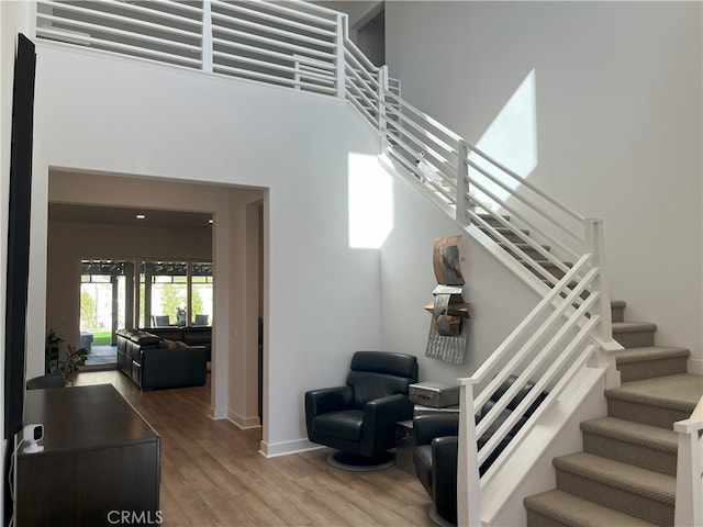 staircase featuring hardwood / wood-style floors