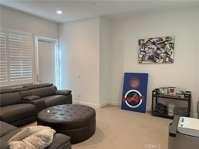 living area with recessed lighting, carpet flooring, and baseboards