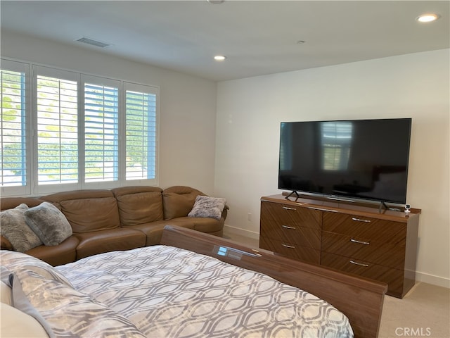 bedroom featuring light colored carpet