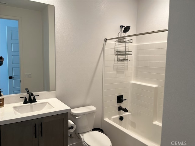 bathroom featuring toilet, shower / bath combination, a textured wall, and vanity