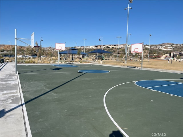 view of basketball court with community basketball court and a gazebo