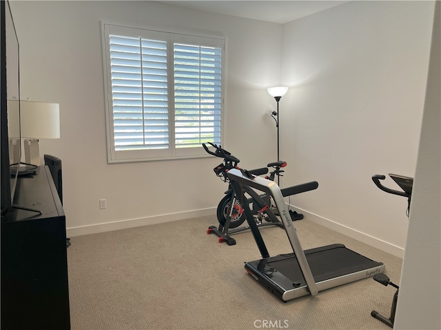 exercise area with plenty of natural light and carpet flooring