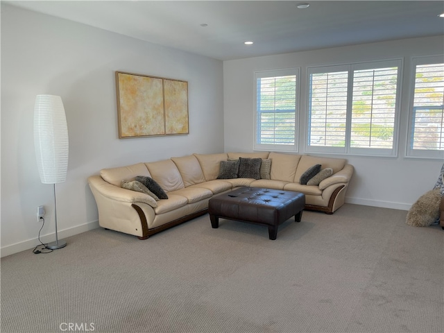 living room with carpet floors, baseboards, and recessed lighting