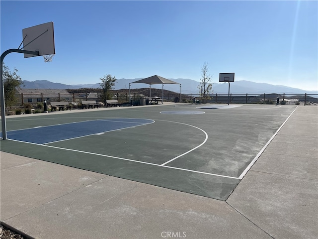 view of basketball court with a mountain view