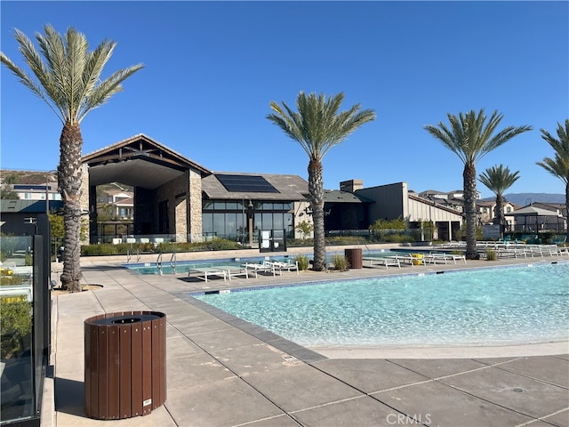 view of swimming pool featuring a patio area