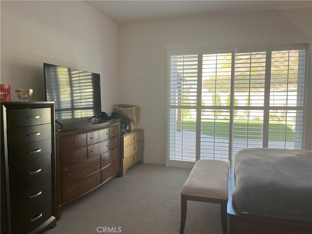 bedroom featuring light colored carpet