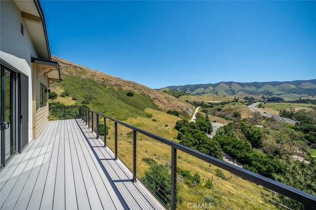 balcony featuring a mountain view