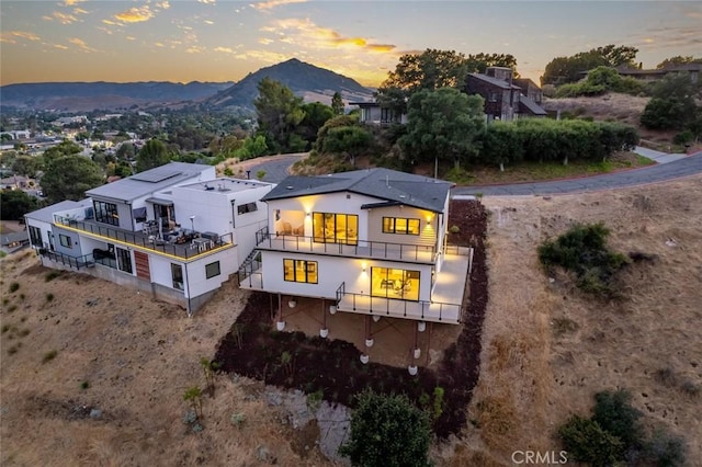 aerial view at dusk with a mountain view