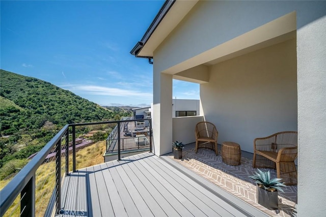 balcony featuring a mountain view