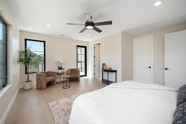 bedroom featuring light wood-type flooring and ceiling fan