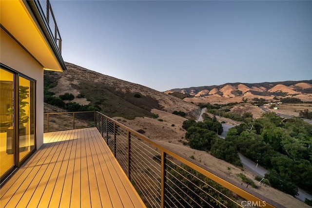 wooden terrace featuring a mountain view