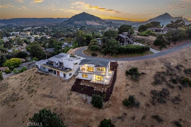 aerial view at dusk with a mountain view