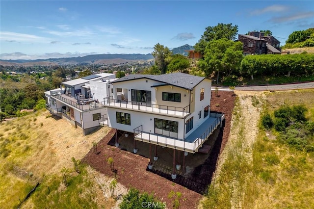 birds eye view of property featuring a mountain view