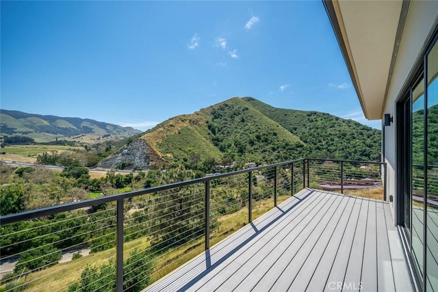 balcony featuring a mountain view