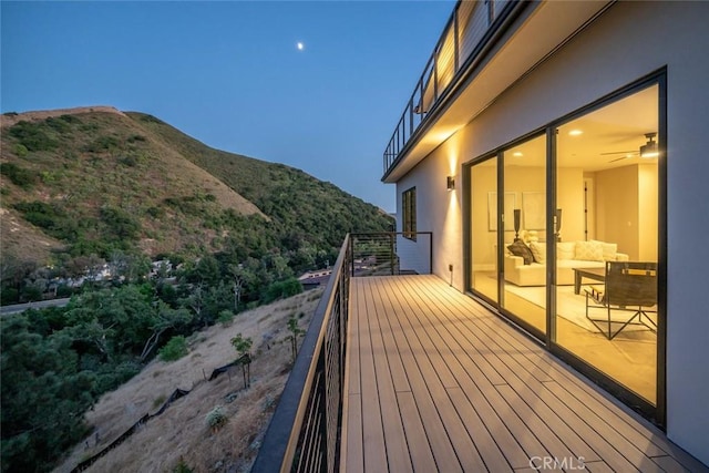 wooden deck with a mountain view