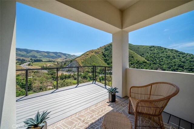 balcony featuring a mountain view