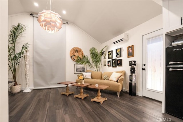 living area with an inviting chandelier, dark hardwood / wood-style floors, vaulted ceiling, and an AC wall unit