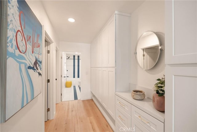 hallway with light hardwood / wood-style flooring