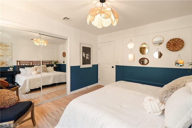 bedroom featuring a closet and light wood-type flooring