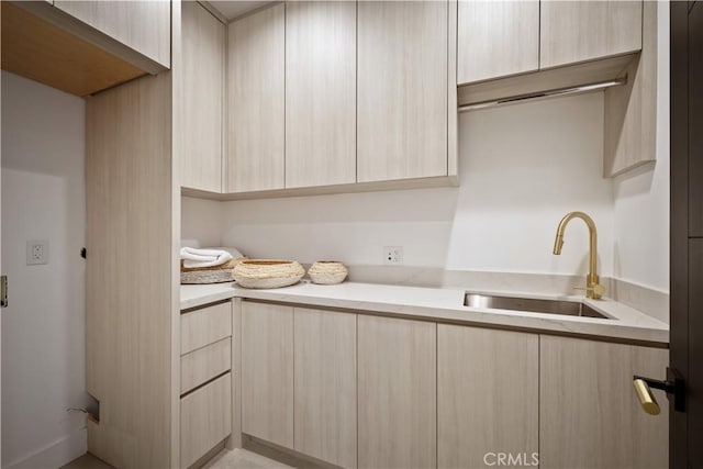 laundry area featuring sink