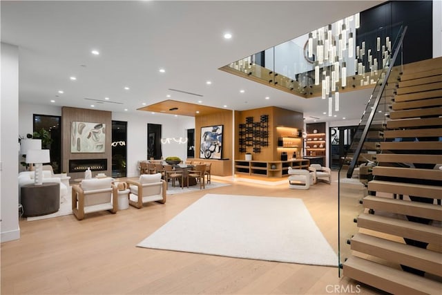 living room with a fireplace and light hardwood / wood-style floors