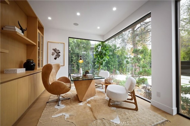 sitting room featuring a healthy amount of sunlight and light hardwood / wood-style flooring