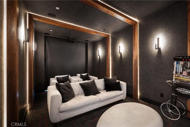 cinema room featuring dark carpet