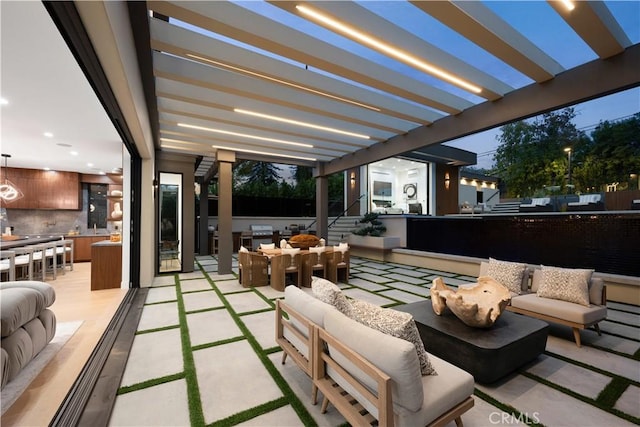 view of patio featuring an outdoor hangout area, a pergola, and a bar