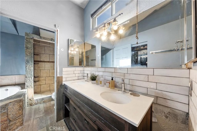 full bathroom featuring toilet, shower with separate bathtub, hardwood / wood-style floors, and vanity