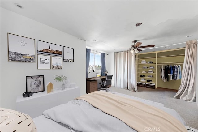 bedroom with a closet, carpet, and ceiling fan